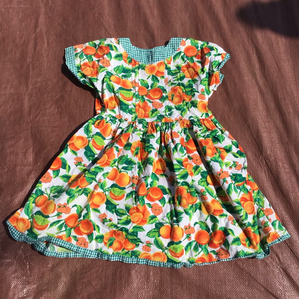 Peach pattern dress by Wee Clancy